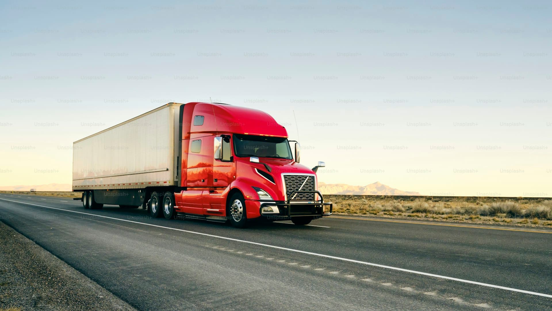 Semi truck hauling freight on an open highway